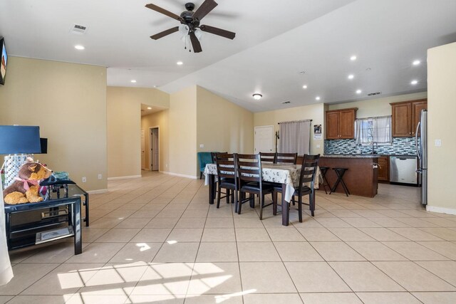 19810 S Spruce Rd, Los Banos, CA 93635 - dining area featuring vaulted ceiling, a ceiling fan, light tile patterned flooring, baseboards, and recessed lighting