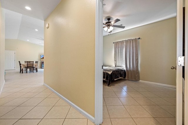 19810 S Spruce Rd, Los Banos, CA 93635 - hallway featuring light tile patterned floors, lofted ceiling, recessed lighting, and baseboards