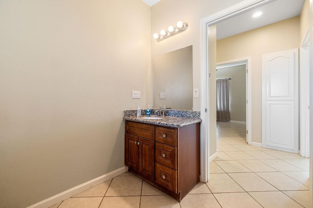 19810 S Spruce Rd, Los Banos, CA 93635 - bathroom featuring vanity, tile patterned floors, and baseboards