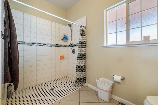 19810 S Spruce Rd, Los Banos, CA 93635 - full bath featuring tiled shower, toilet, tile patterned flooring, and baseboards