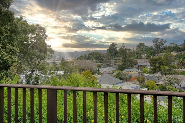 view of balcony at dusk