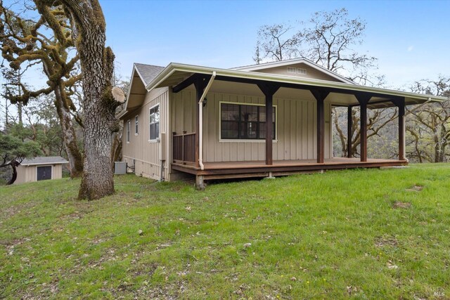8401 Brandywine Dr, Ukiah, CA 95482 - view of front of property with covered porch, an outdoor structure, and a front lawn