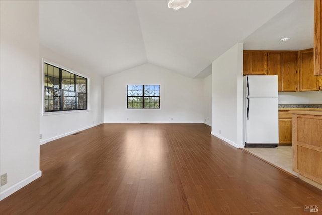 8401 Brandywine Dr, Ukiah, CA 95482 - unfurnished living room with dark wood finished floors, baseboards, and vaulted ceiling
