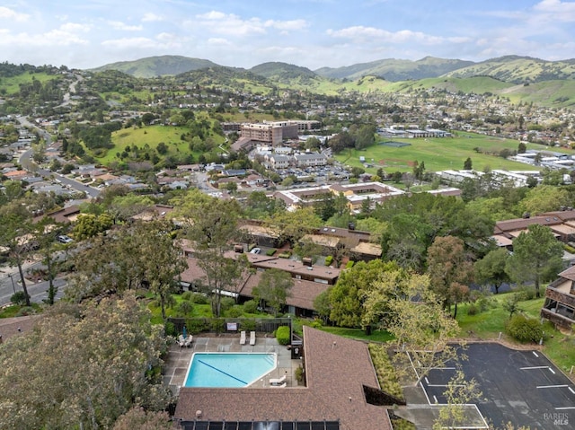 birds eye view of property with a mountain view