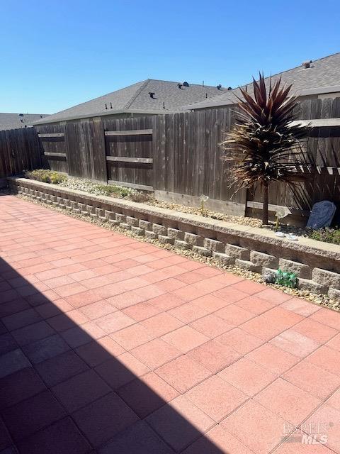view of patio / terrace featuring fence