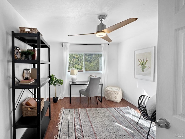 office featuring baseboards, ceiling fan, and wood finished floors
