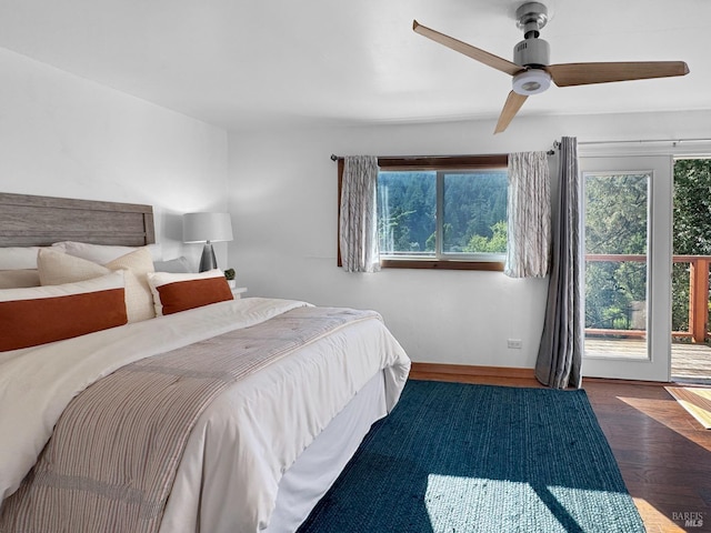 bedroom featuring a ceiling fan, wood finished floors, and access to exterior
