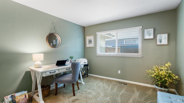 office area featuring carpet, baseboards, and visible vents