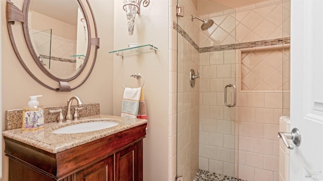 bathroom with vanity and a shower stall