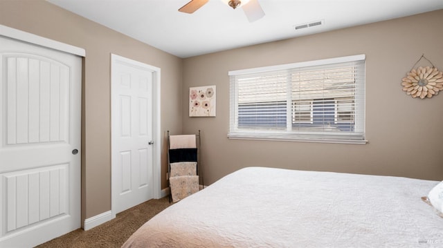 bedroom featuring a ceiling fan, a closet, carpet, baseboards, and visible vents