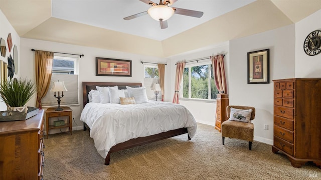 bedroom with carpet flooring, multiple windows, and baseboards