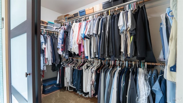 walk in closet featuring carpet