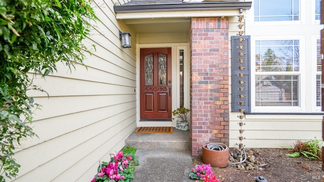 entrance to property with brick siding