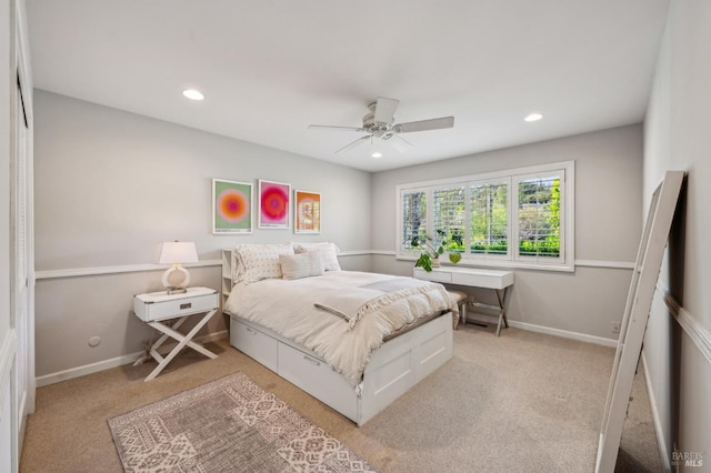 bedroom with baseboards, light colored carpet, and recessed lighting
