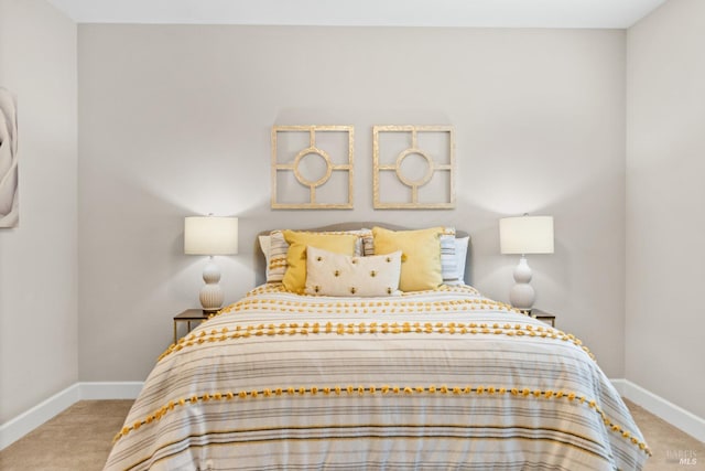 bedroom featuring carpet flooring and baseboards