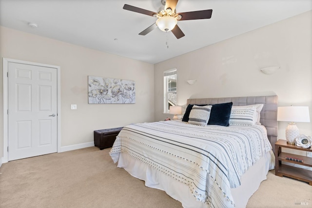 bedroom with baseboards, carpet floors, and ceiling fan