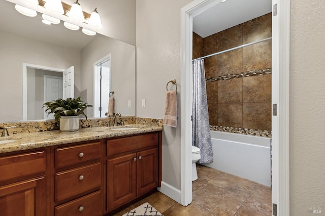 full bath with toilet, a sink, double vanity, and shower / bath combo