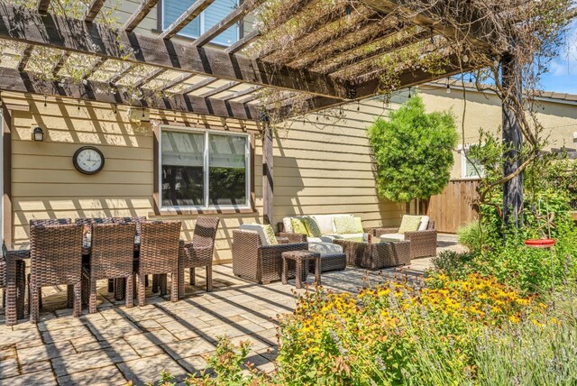 view of patio with fence, a pergola, and outdoor lounge area
