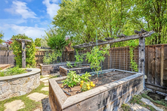 view of yard with a garden and fence