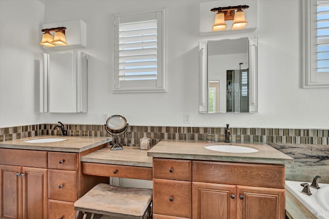 bathroom with a bath, tasteful backsplash, and vanity