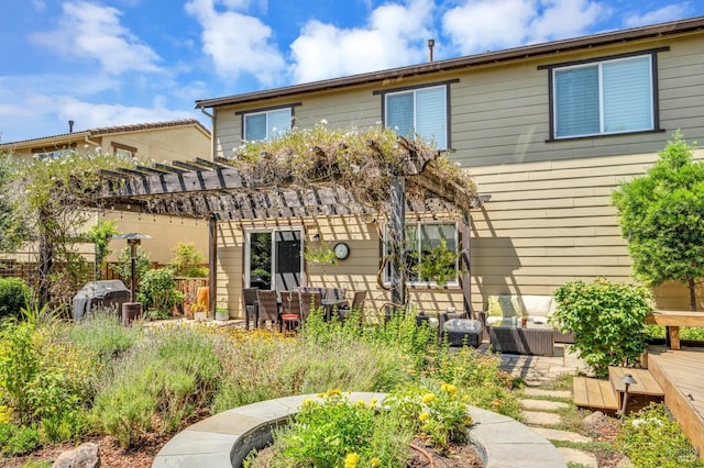 back of house with a pergola and outdoor lounge area