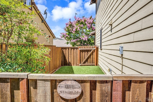 view of yard featuring a gate and fence