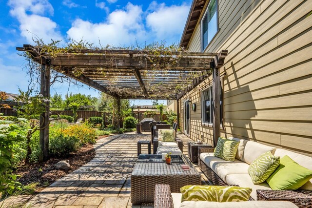 view of patio featuring a fenced backyard, an outdoor hangout area, and a pergola