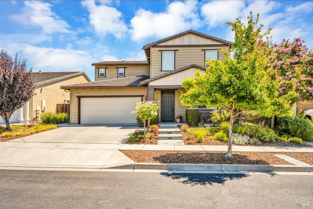 view of front of home with concrete driveway and an attached garage