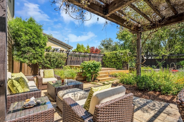 view of patio / terrace featuring a fenced backyard and an outdoor living space