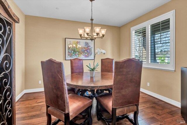 218 Saffron Ct, Napa, CA 94559 - dining space with baseboards, dark wood-style flooring, and a chandelier