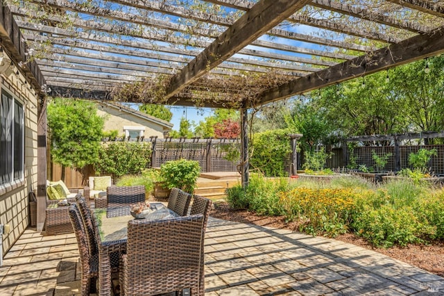 view of patio with a fenced backyard and a pergola