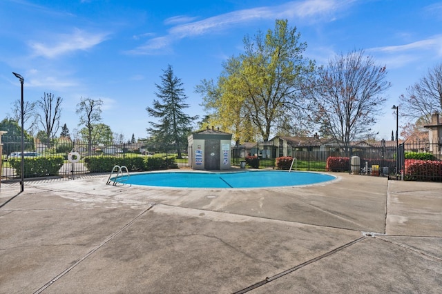 community pool featuring fence