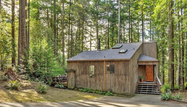 view of outbuilding with a wooded view