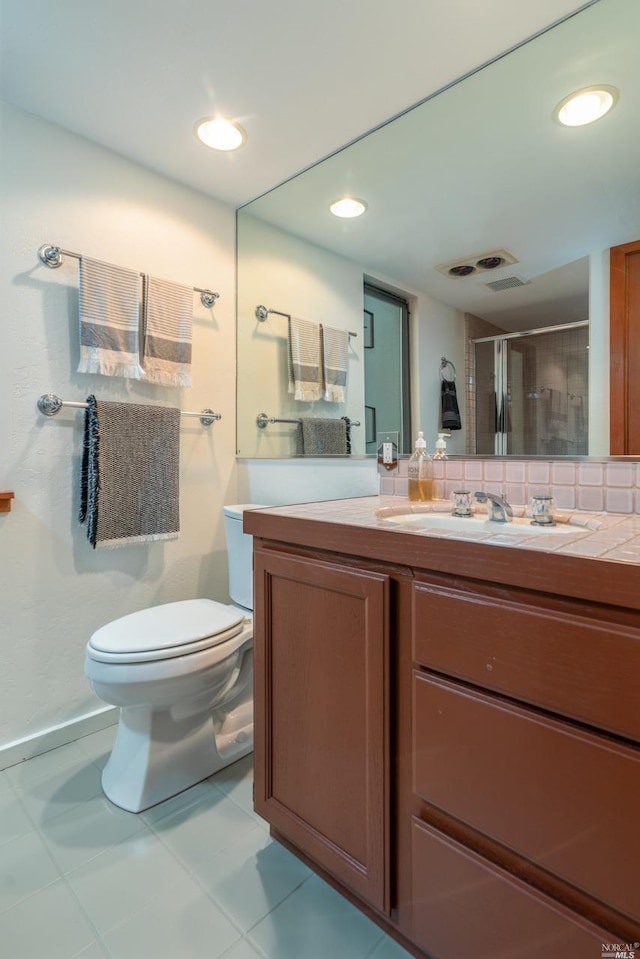 full bath with toilet, vanity, a shower stall, tasteful backsplash, and recessed lighting