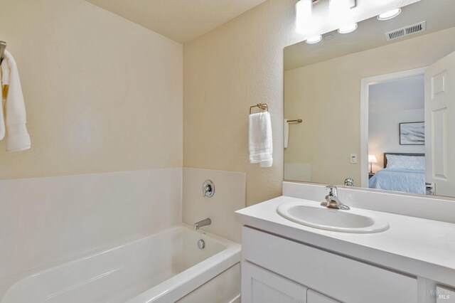 bedroom featuring a closet, carpet flooring, baseboards, and ceiling fan