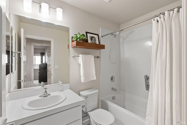 bedroom featuring a closet, a ceiling fan, carpet, and baseboards