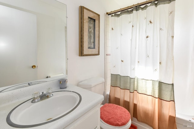 bathroom with shower / bath combination with curtain, toilet, and vanity