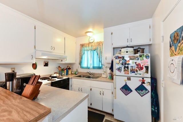 kitchen featuring light countertops, a sink, freestanding refrigerator, under cabinet range hood, and black / electric stove
