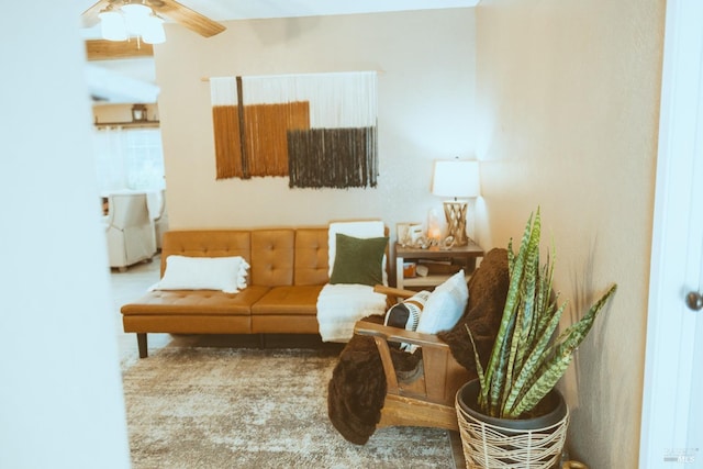 living area with ceiling fan