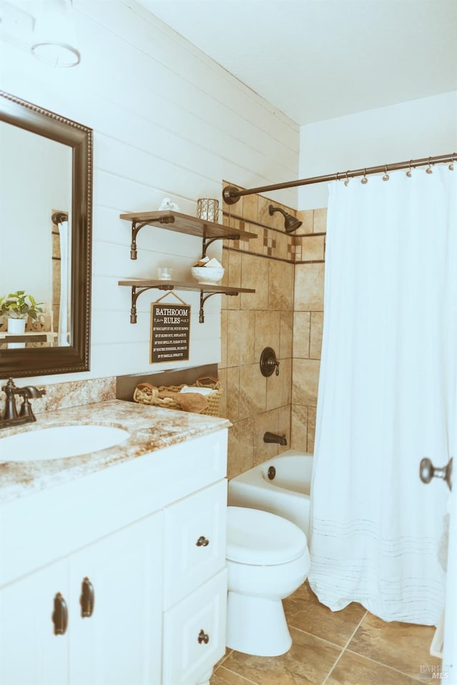 full bathroom featuring vanity, toilet, shower / bath combo, and tile patterned floors