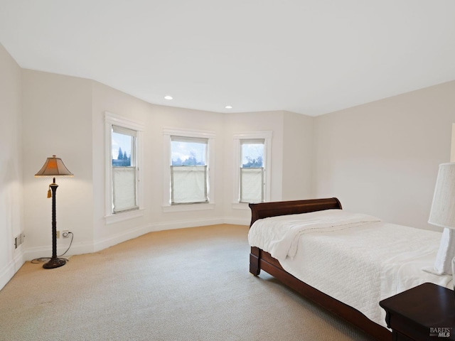 carpeted bedroom featuring baseboards, recessed lighting, and visible vents