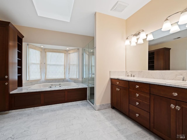 full bath featuring a garden tub, a sink, a stall shower, and double vanity
