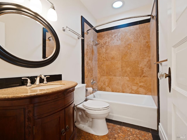 bathroom featuring vanity, tile patterned flooring, bathtub / shower combination, and toilet