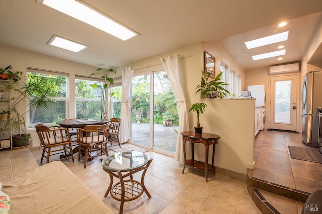 dining area with light tile patterned floors, a skylight, an AC wall unit, and recessed lighting