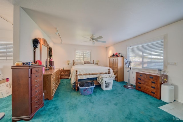 carpeted bedroom featuring ceiling fan