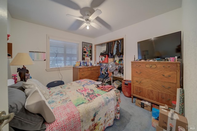 carpeted bedroom with a closet and a ceiling fan