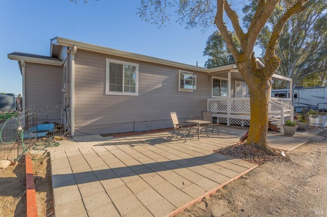 back of property featuring a patio