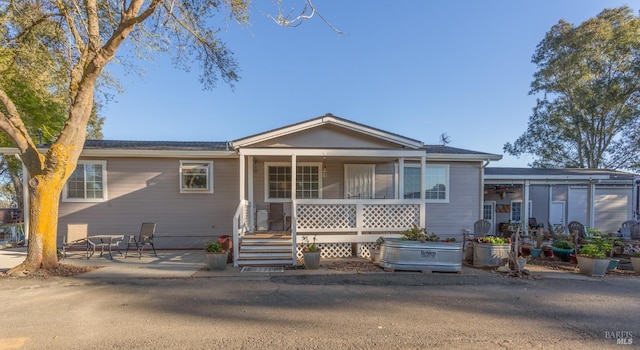 view of front of house featuring a patio and covered porch