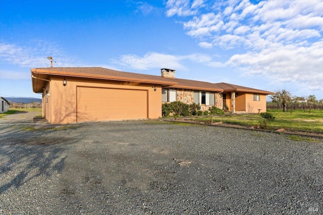 2062 Woolsey Rd, Fulton, CA 95439 - ranch-style house featuring a garage, stucco siding, and a chimney