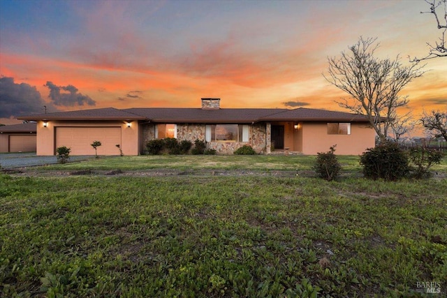 2062 Woolsey Rd, Fulton, CA 95439 - view of front of home with an attached garage, a chimney, stucco siding, a front lawn, and driveway